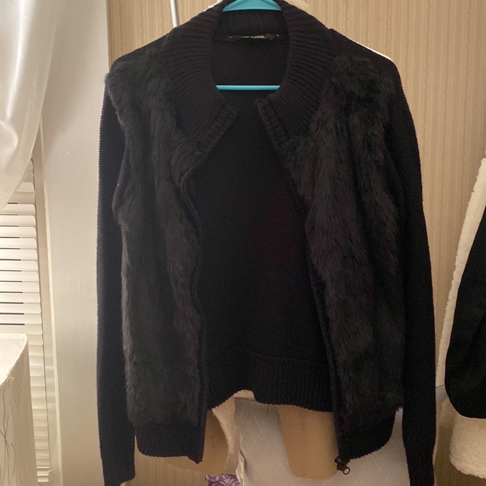 Black sweater/fur coat